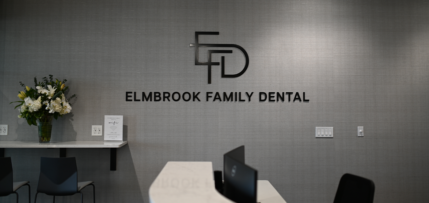 Front desk in Wauwatosa dental office with Elmbrook Family Dental logo on wall