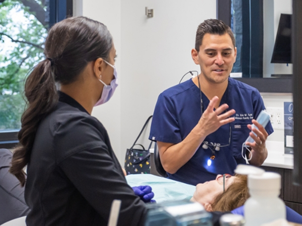 Dentist explaining a treatment to a patient