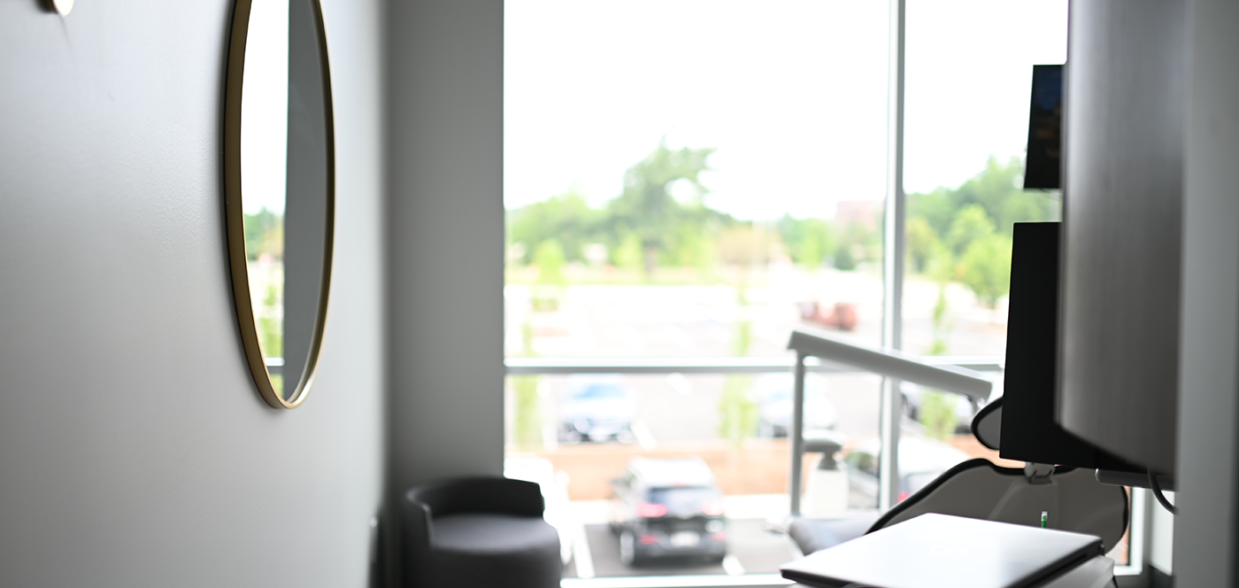 Dental treatment room with a mirror on the wall in Wauwatosa dental office