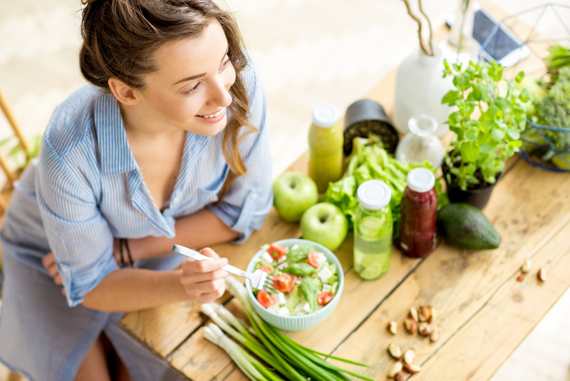 Patient with good dental health smiling while eating