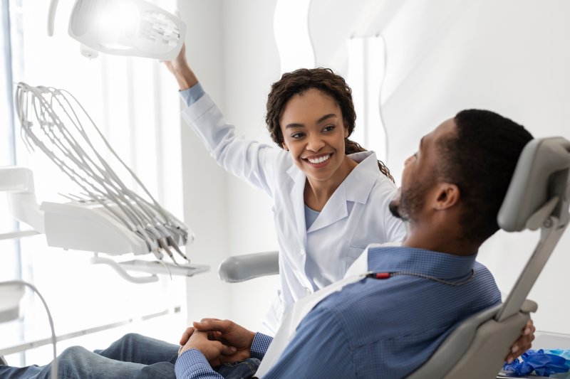 Dentist talking to patient at dental checkups