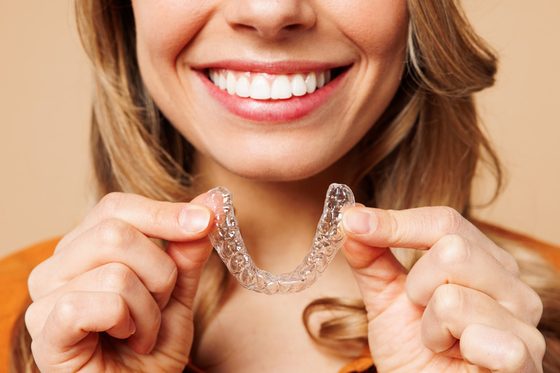 Patient smiling with Invisalign